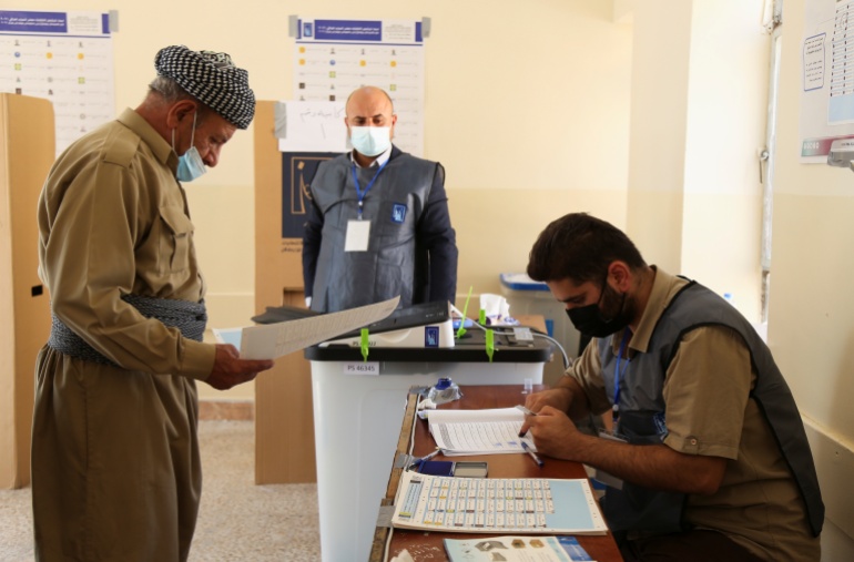 A man visits a polling station to cast his vote in the Iraqi parliamentary election, in Duhok, Iraq, October 10, 2021. REUTERS/Ari Jalal