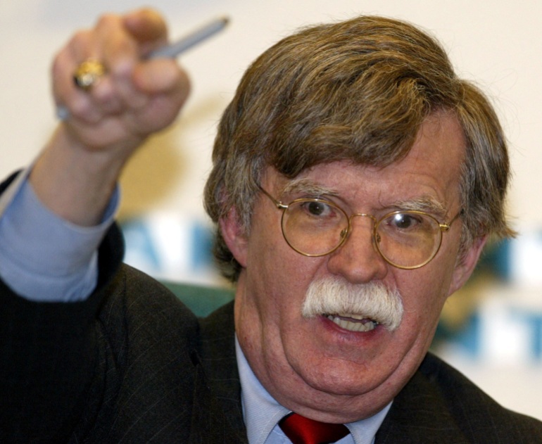 FILE PHOTO: U.S. Undersecretary of State John Bolton gestures during his news conference in Moscow, February 25, 2003. Bolton said on Tuesday he had been unable to convince Russian officials after two days of talks to line up behind a U.S.-backed resolution authorising force against Iraq. REUTERS/Alexander Natruskin/File Photo